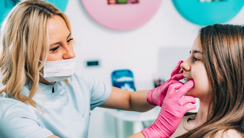 What treatments does a pediatric dentist specialize in?