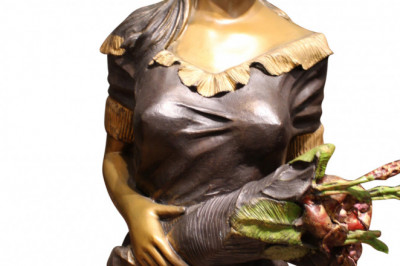 Woman Holding Bouquet Standing on Lily Bronze Statue