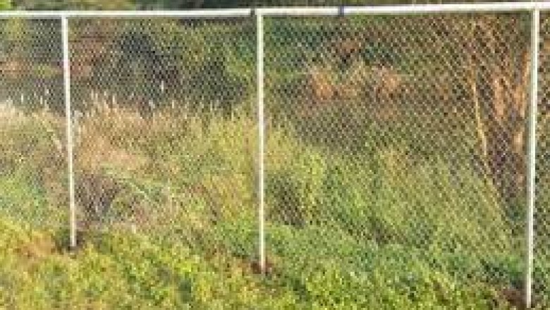 Fencing is a structure that encloses an area; usually constructed from posts that are connected by rails, wire, boards, or netting