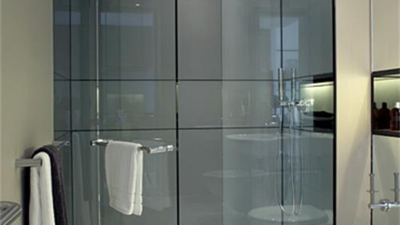 What are the effects of adopting glass doors in your shower?