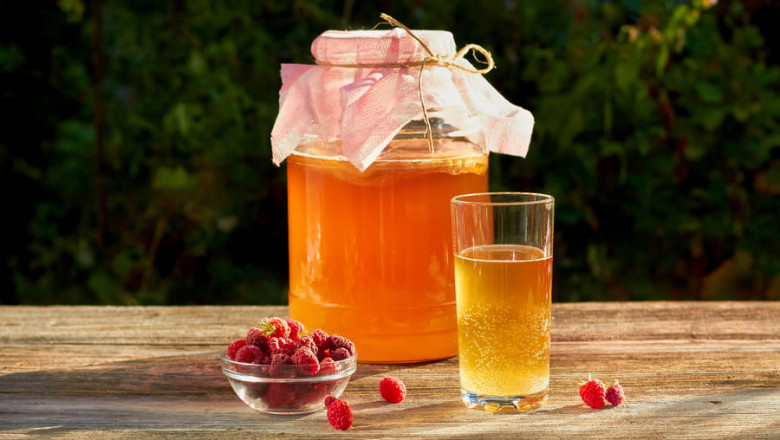 Small batches of kombucha are typically made at home in glass jars topped with fabric