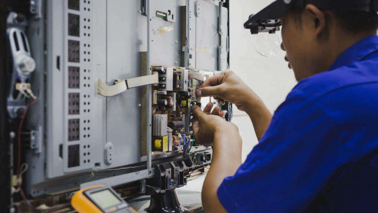 commercial TV repair technician